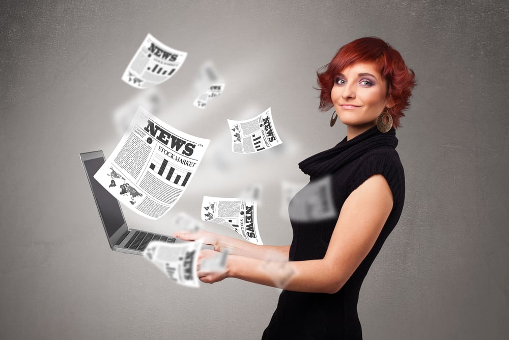 Casual pretty young woman holdin notebook and reading the explosive news Casual pretty young woman holdin notebook and reading the explosive news