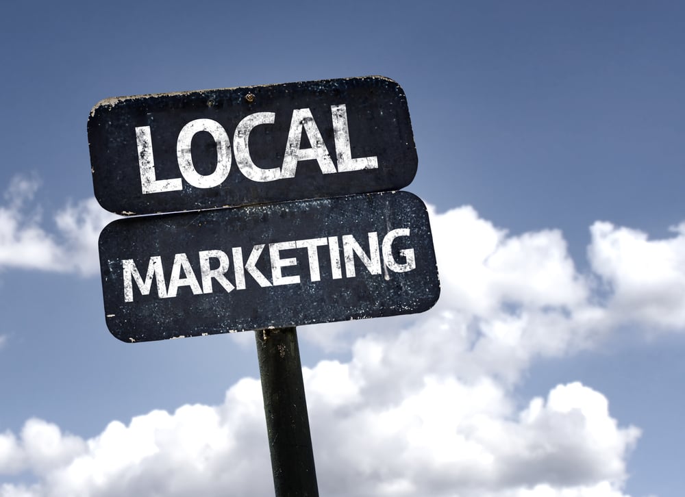 Local Marketing sign with clouds and sky background