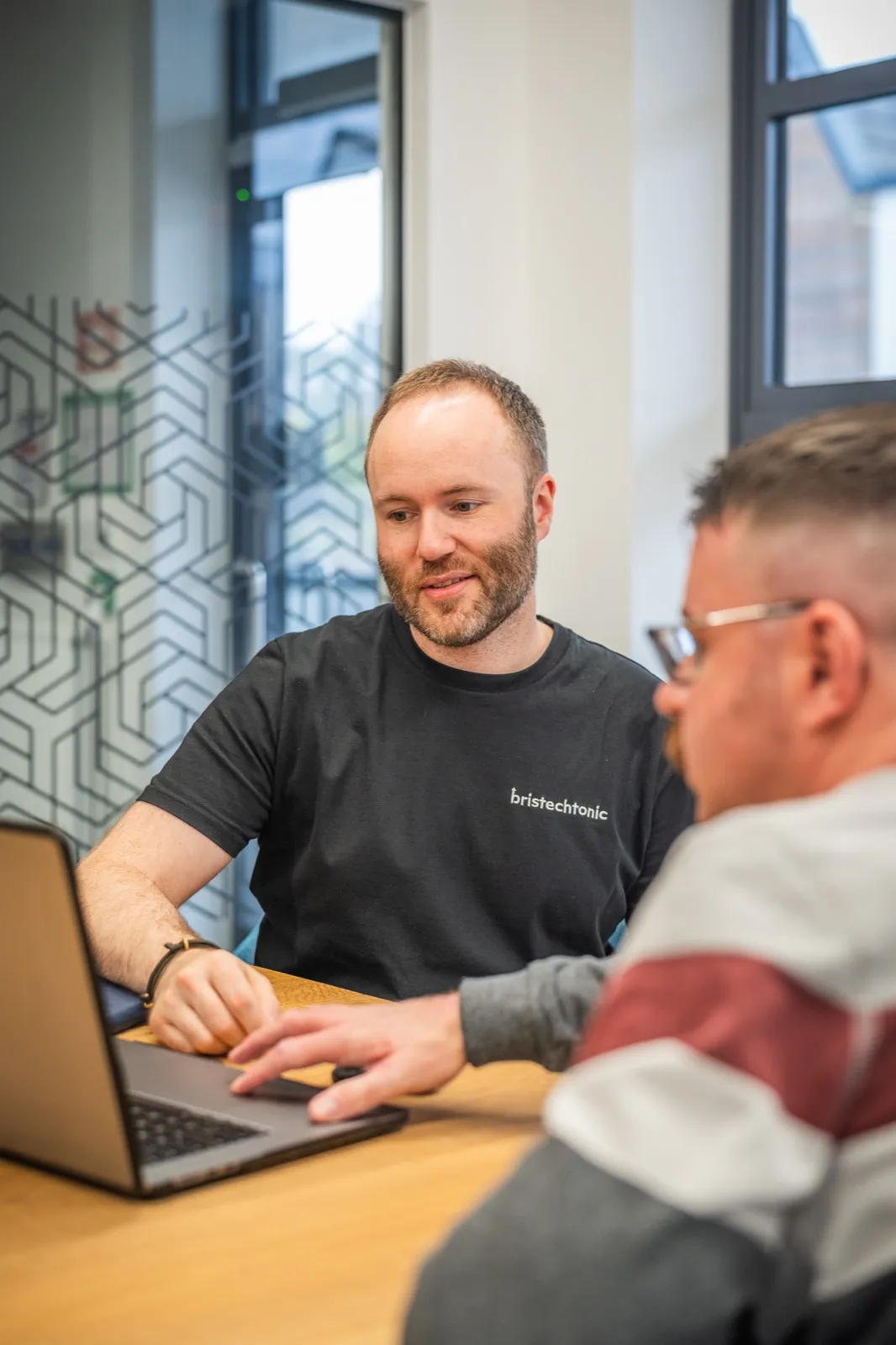 The BrisTechTonic team discussing a client's search strategy