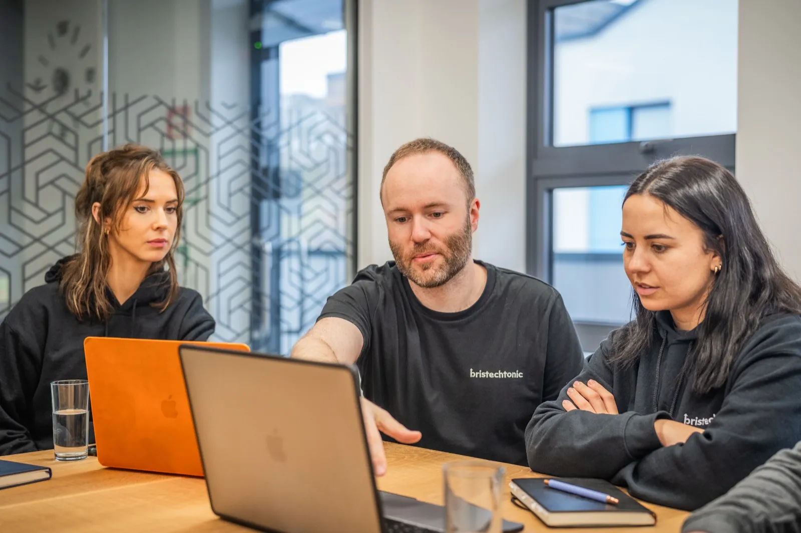 Two BrisTechTonic team members working through an SEO plan