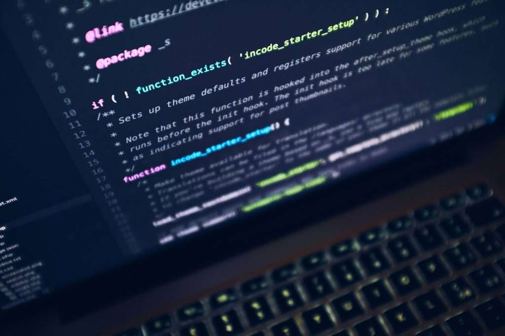 Code on a laptop screen representing FAQ schema markup used by AI search engines