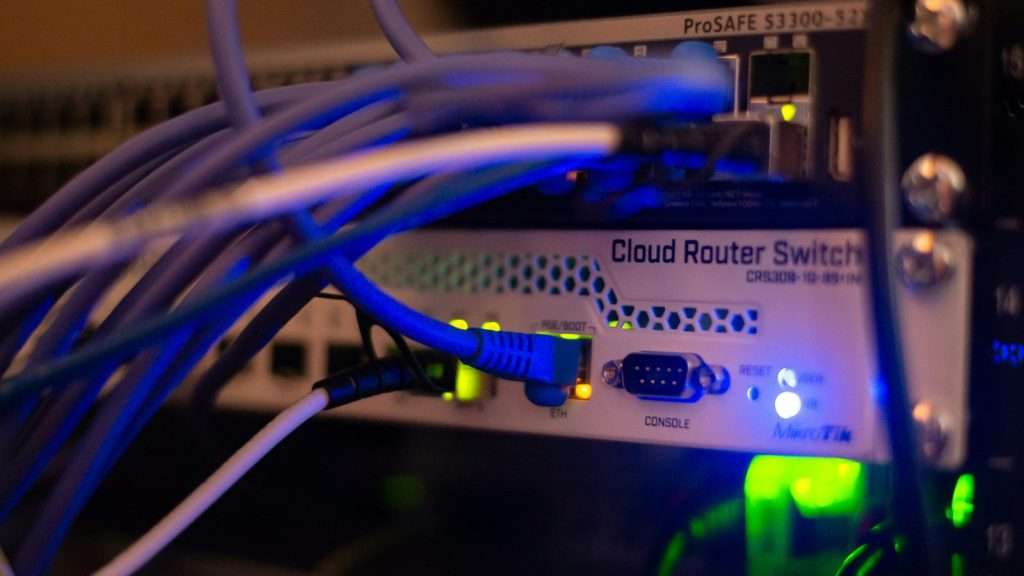 Computer networking equipment with ethernet cables, representing the technical infrastructure layer where AI bots are accidentally blocked by Cloudflare and robots.txt