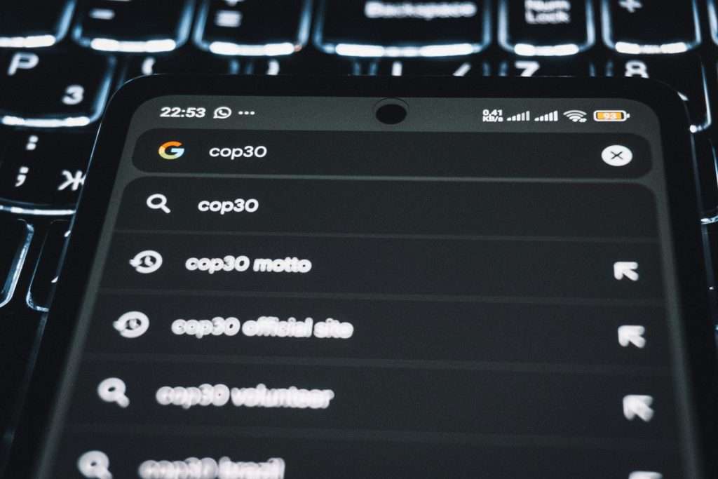 Smartphone displaying search results for cop30