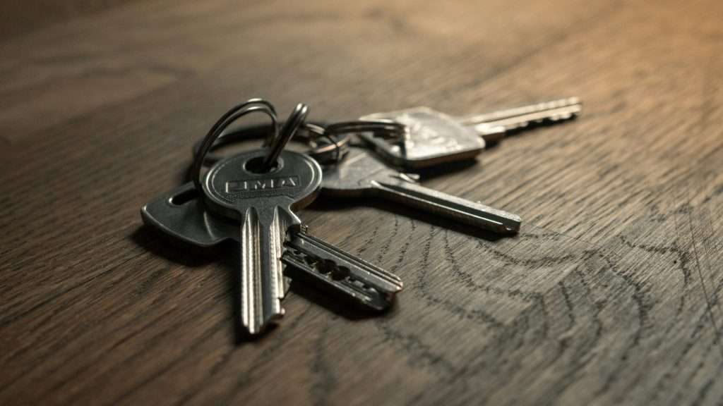 Locksmith keys on wooden table