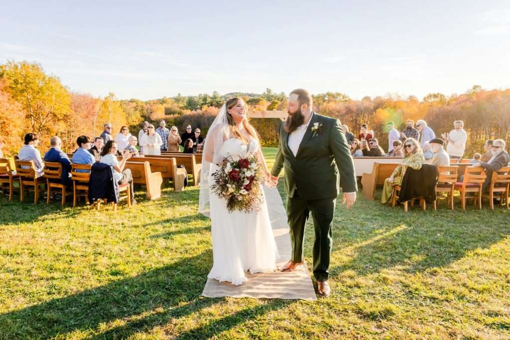 Bride and groom walking down the aisle at their wedding ceremony