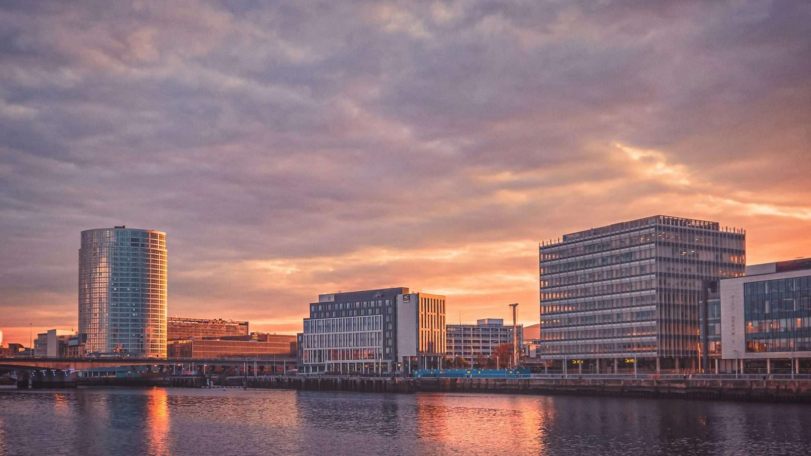Belfast city skyline at sunset across the River Lagan
