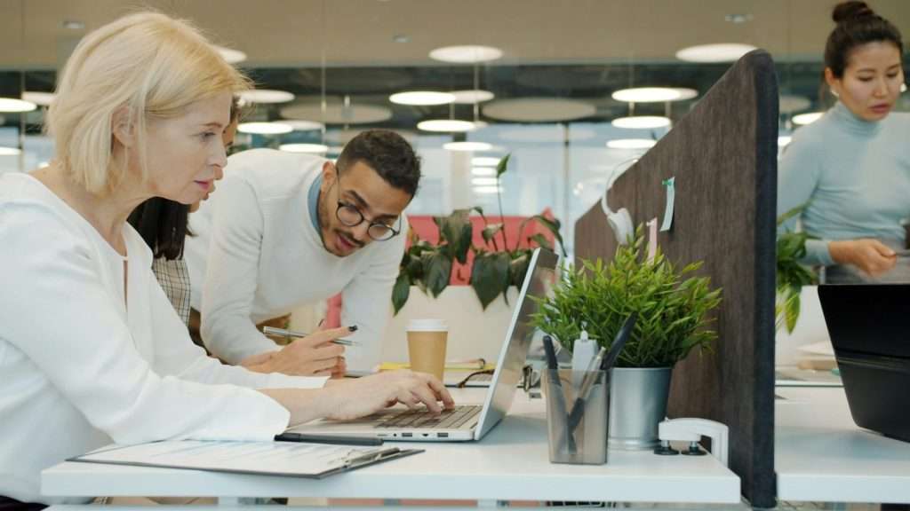 Coworkers collaborating in a open-space coworking office