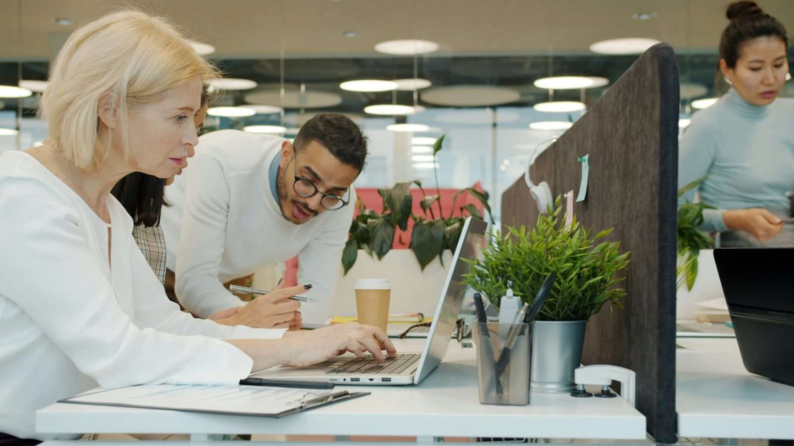 Coworkers collaborating in a open-space coworking office