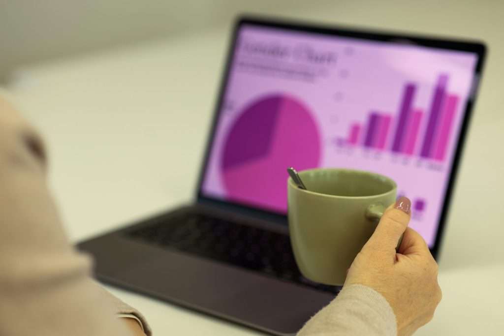 Laptop displaying SEO analytics dashboard with charts and graphs