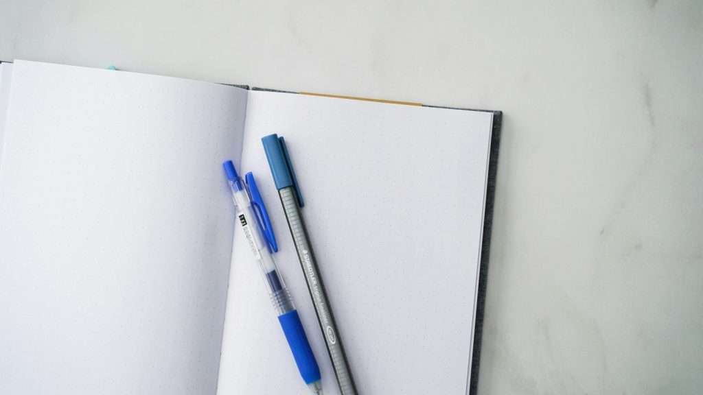 Open notebook with pen representing content planning and strategy